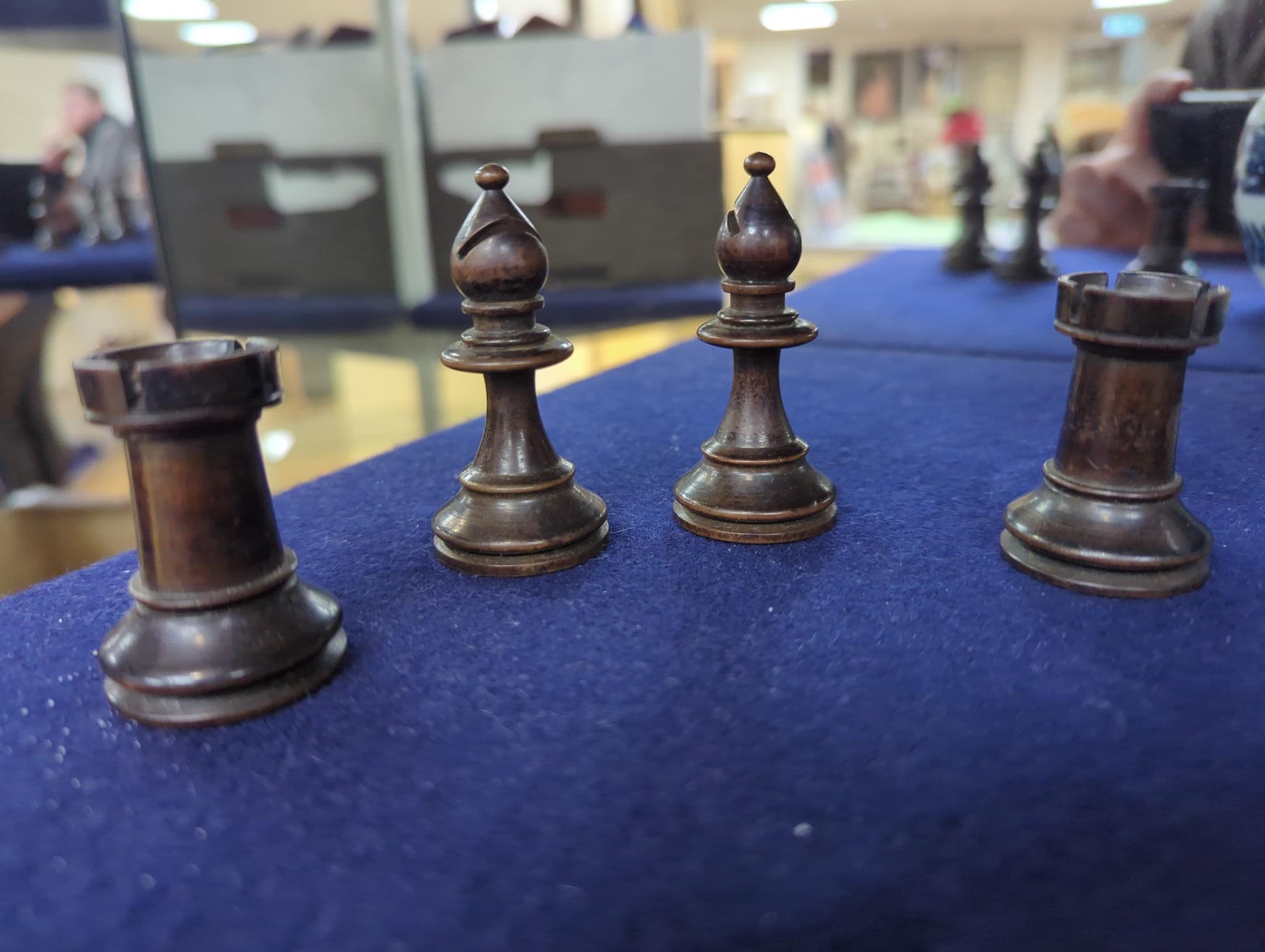 After Mene, a bronze greyhound, a Staunton-pattern chess set and a set of Victorian postal scales, bronze 22cms wide